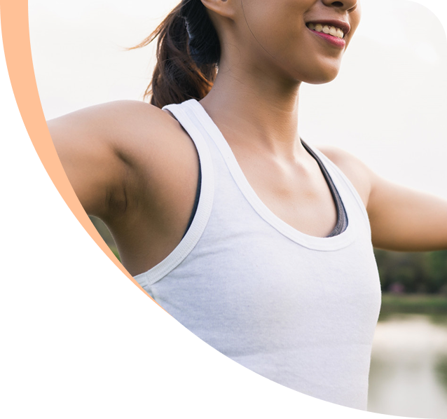 Woman stretching outdoors, representing wellness and urology care at Urology Alliance.